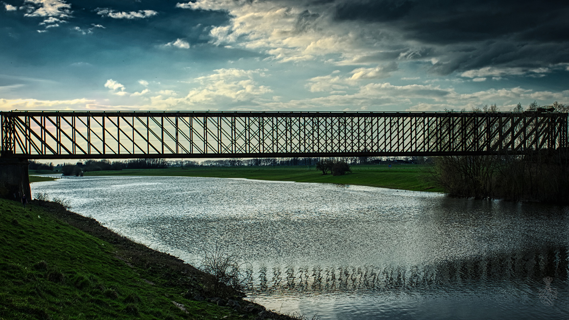 Iron bridge over muddy water